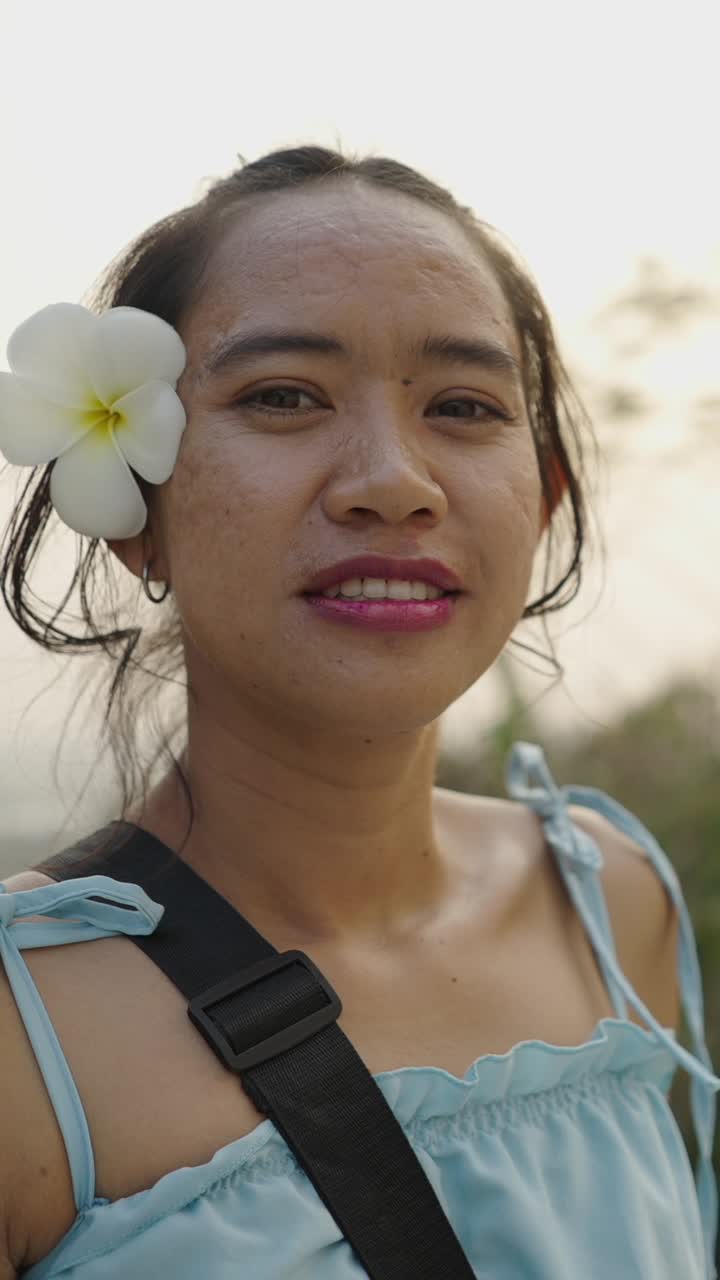 Portrait of a woman with a flower in her hair