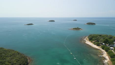 Stunning-aerial-seascape-of-little-islet-on-the-Adriatic-Sea-in-Vrsar-little-traditional-town-in-Croatia