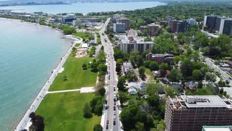 Drone-flying-along-downtown-Burlington-lakeside-on-sunny-day