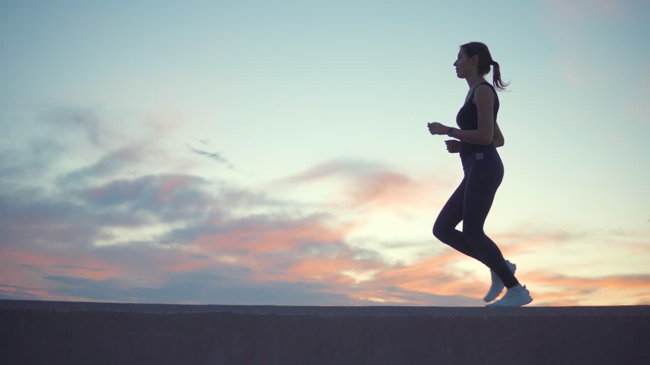 Woman Running at Sunset