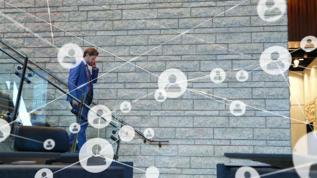 Businessman on phone walking down stairs, network connections animation over brick wall