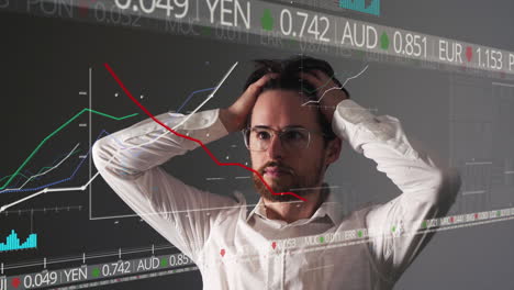 stressed young business man pulling his hair up while looking frustrated at negative graph falling prices