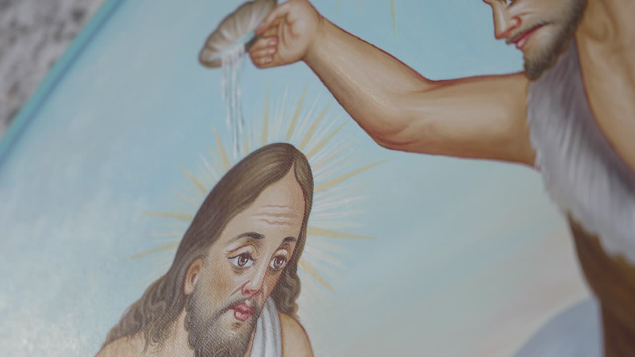 close up of painted baptism scene with flowing water and radiant halos