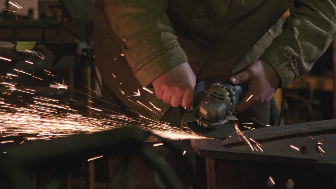 Male Hands Welding Iron At Factory