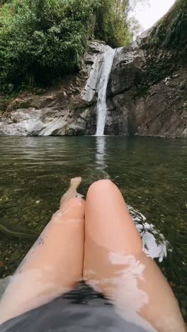 relaxing by a waterfall