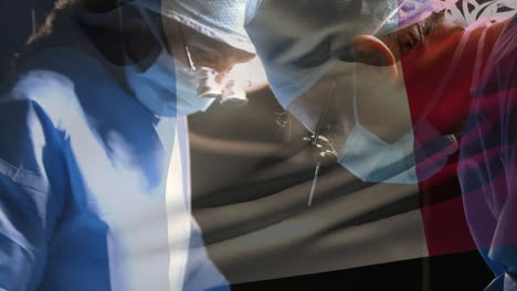 animation of flag of france waving over surgeons in face masks