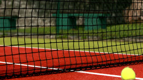 tennis balls hitting the net