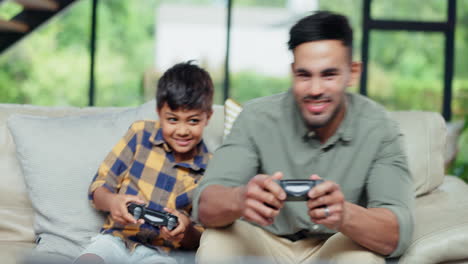 Father,-child-and-play-video-game-in-home-living