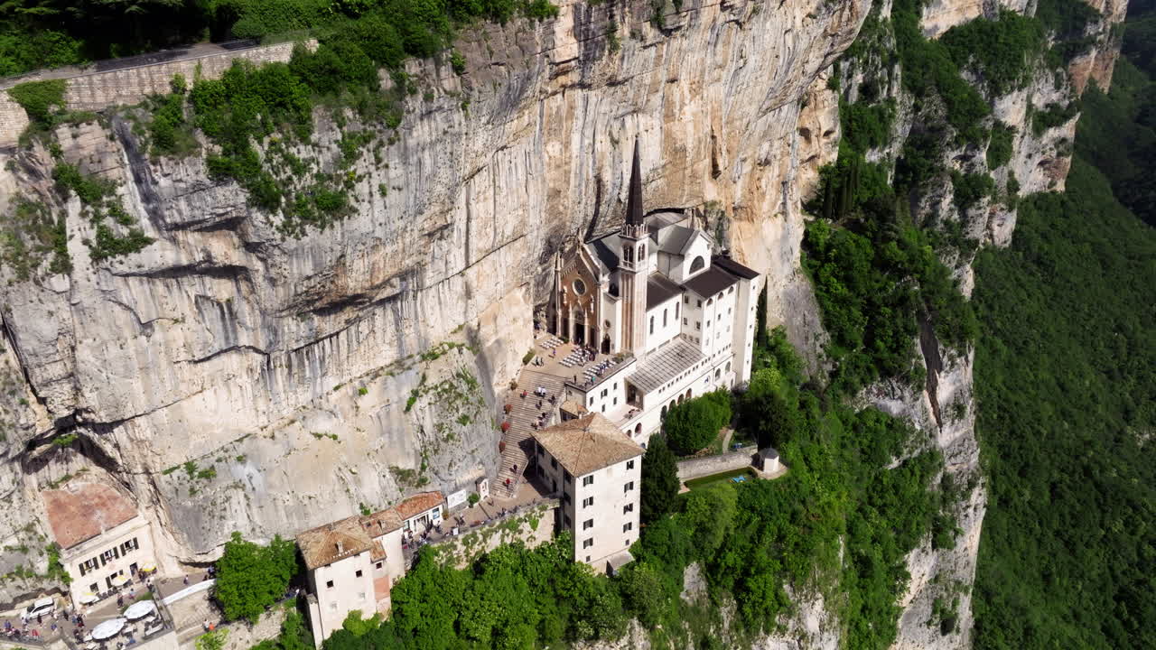 Santuario de la Madonna della Corona Built On The Rocky Mountainside, Province of Verona, Italy. Aerial Drone Shot