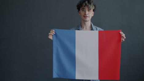 man holding the french flag