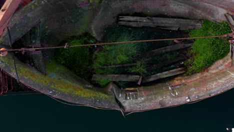 Drobe-flying-over-lifeboat-of-abandoned-rusty-shipwreck