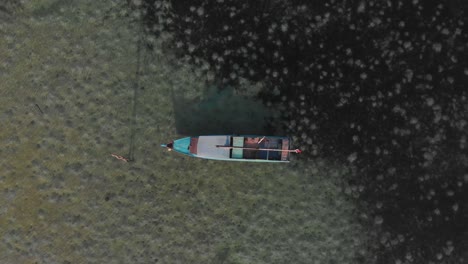 traditional fishing boat at indonesia during sunrise, aerial