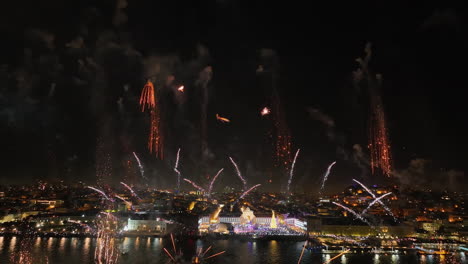 aerial view of new years eve fireworks and the lisbon city skyline in portugal