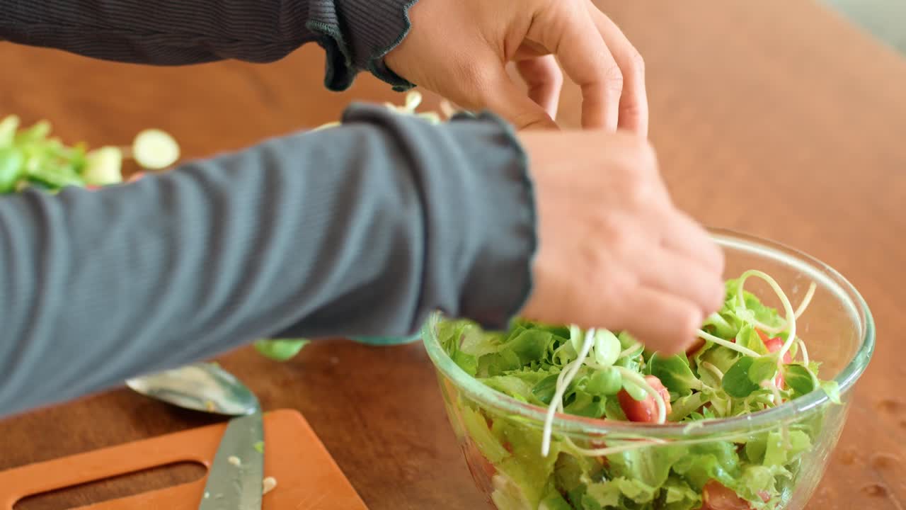 Preparing a healthy salad with microgreens