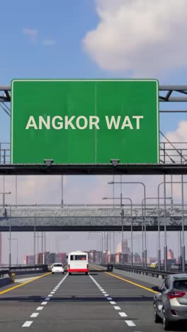 highway sign to angkor wat with airplane in the sky