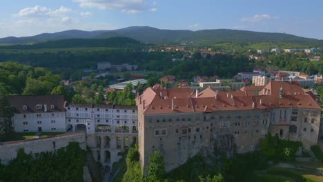 Fantastic-aerial-top-view-flight-Krumlov-castle-on-the-hill-castlein-in-czech-republic-Cesky-in-Europe,-summer-of-2023