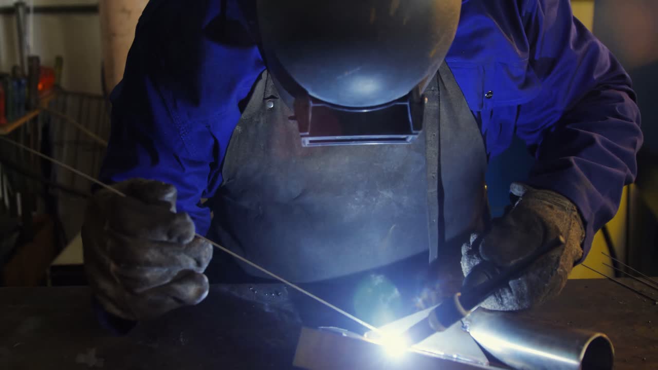Welder welding a metal