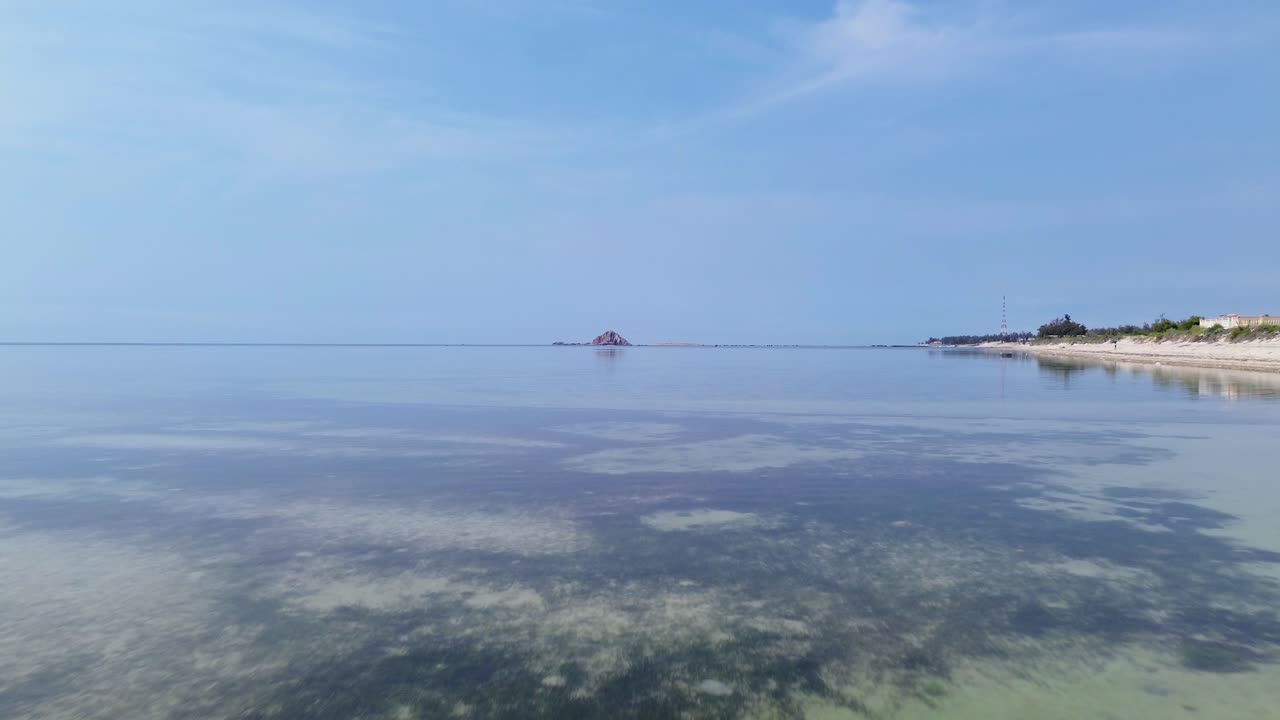 Beautiful aerial drone footage of My Hoa Lagoon with calm waters and lush tropical surroundings in Vietnam, perfect for travel and nature themes
