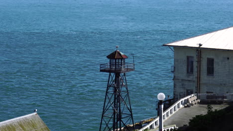 guard tower of alcatraz prison with view of san francisco bay and city