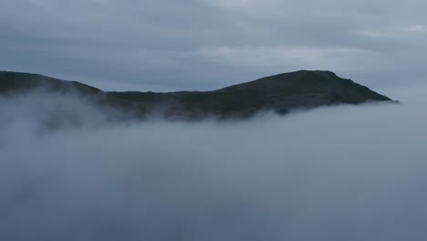 remote, misty landscape from a high perspective. north norway