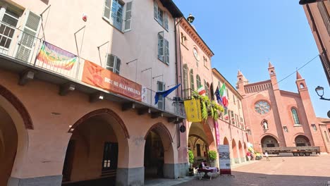 vibrant flags adorn historic buildings in alba