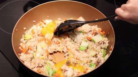 sequence of frying rice with vegetables and egg