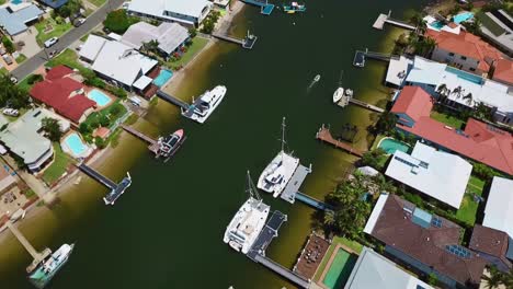 aerial view of coastal town district with houses by the canal for boats