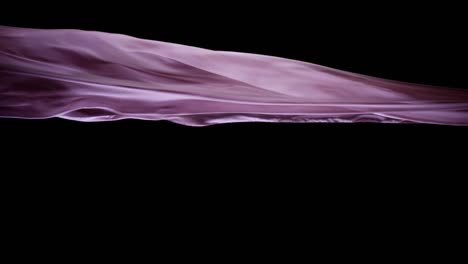 smooth pink silk flying in black background