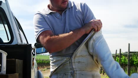 beekeeper wearing bee suit while preparing for harvest