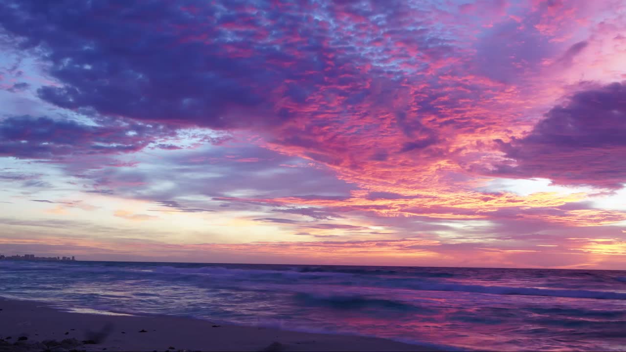 Stunning Sunset over Ocean Beach with City Skyline