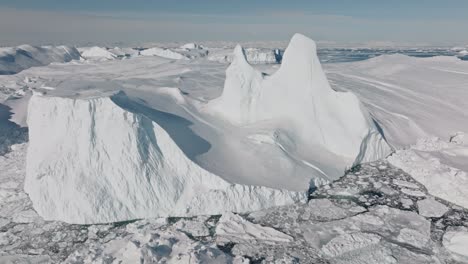 drone over sea and ice of ilulissat icefjord