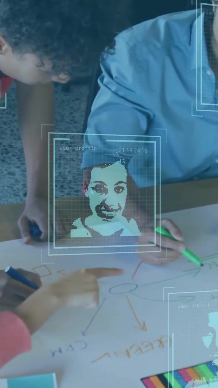 Animation of data processing with portraits over diverse colleagues having meeting in office