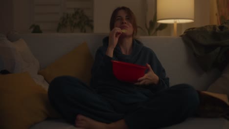 woman watching movie at home