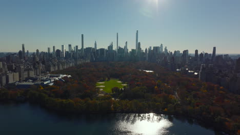 Amazing-panoramic-footage-of-Central-park-and-modern-high-rise-office-towers.-Autumn-colour-foliage-on-trees.-Manhattan,-New-York-City,-USA