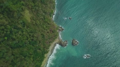 drone shot of ocean shore line just over mount dillon lookout in tobago, west indies