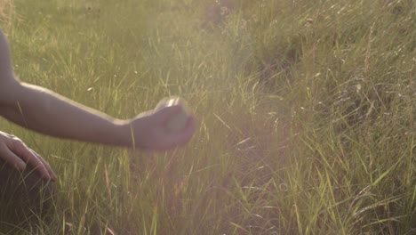 carefree woman relaxing by throwing a ball