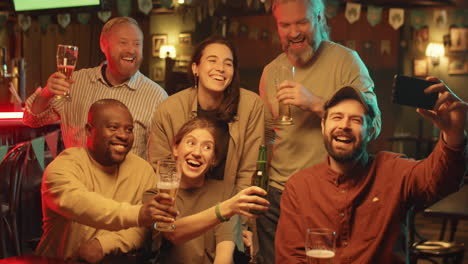 friends taking selfie in pub