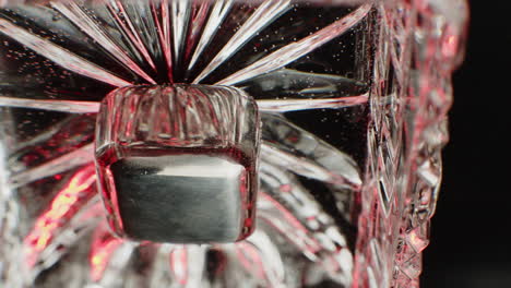 close-up of a crystal glass with an ice cube