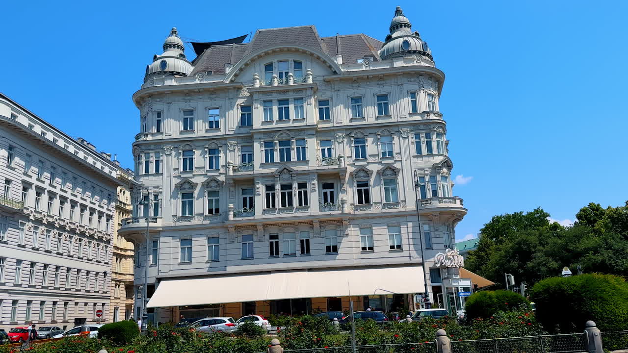 Vienna, Austria - June 9, 2025: Tourists enjoy a sunny day in Vienna. Visitors explore the beautiful architecture of Vienna, Austria, under a clear blue sky filled with excitement