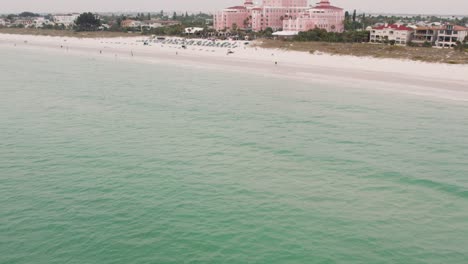 Drone-shot-from-over-the-water-of-famous-historic-pink-hotel-on-St