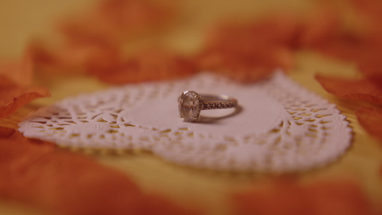 Elegant Diamond Engagement Ring on Lace Paper