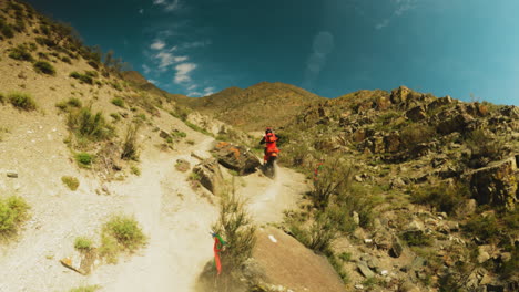 skilled rider accelerates up hill fpv drone. motorbike roar echoes through landscape as soundtrack to sportsman daring display of agility and control over challenges