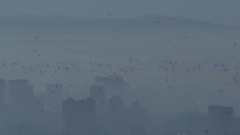 animation of glowing spots floating over cityscape