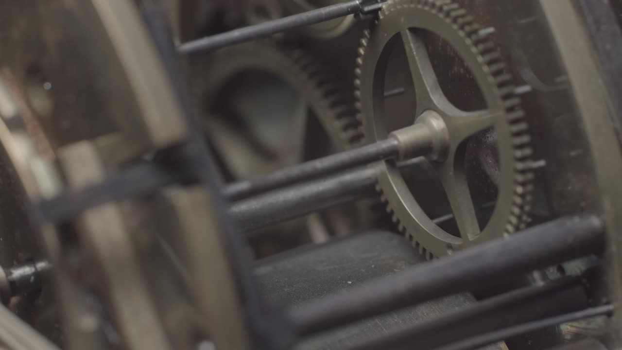 An antique vintage clock with the tick-tock mechanism movement
