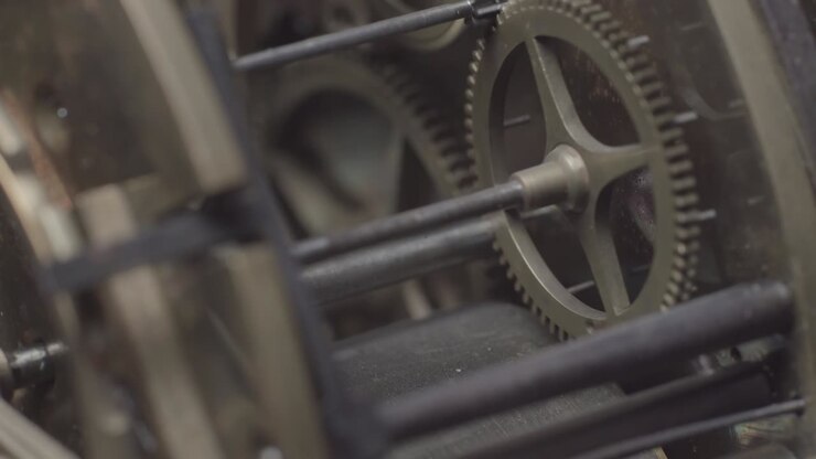 An antique vintage clock with the tick-tock mechanism movement