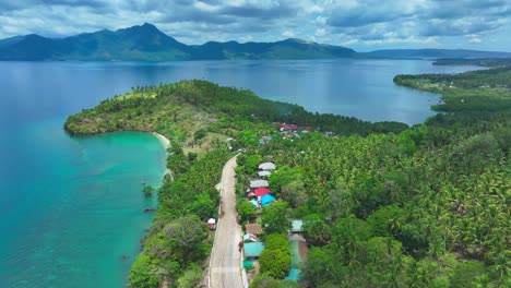 Slow-drone-flyover-tropical-Biliran-Island-with-turquoise-bay-during-sunny-day-in-Philippines