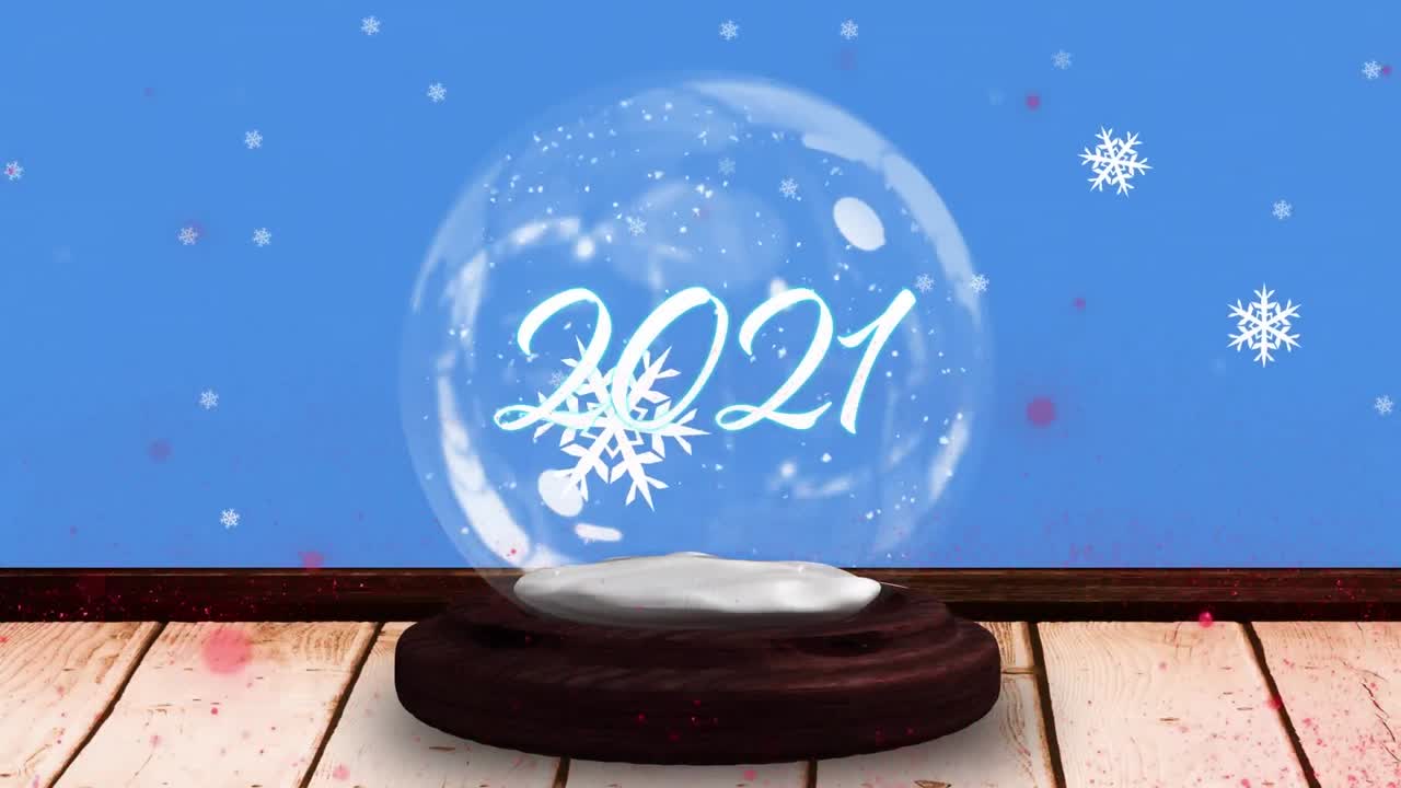 크리스마스 텍스트와 파란색 배경에 내리는 눈이 있는 스노우 글로브의 애니메이션