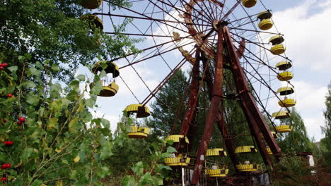 rustic and abandoned ferris wheel in pripyat, close up zoom out view