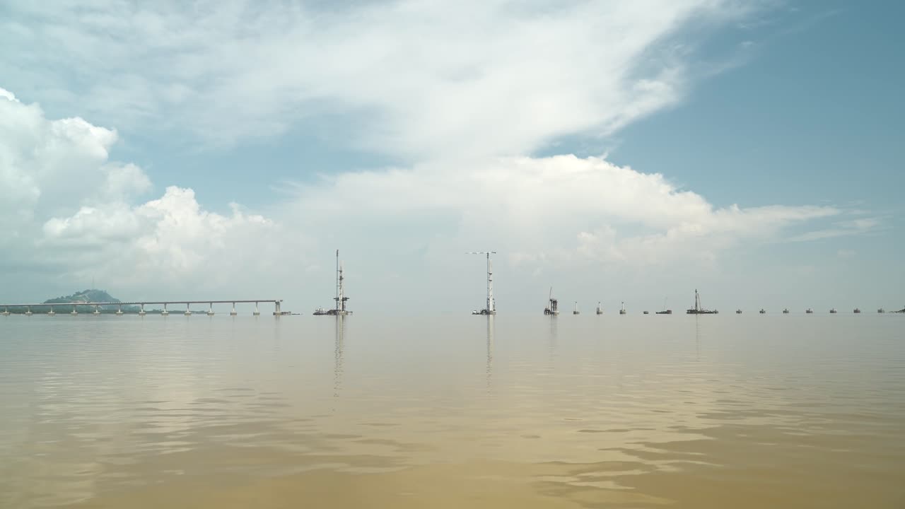 Batang Lupar Sarawak River Ferry Ride View During Summer And Under Construction Longest Bridge Conecting From each side,Sarawak,Borneo.