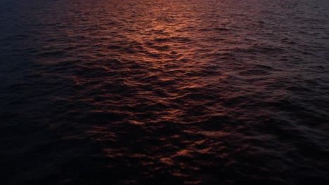 sea water under sunset sky